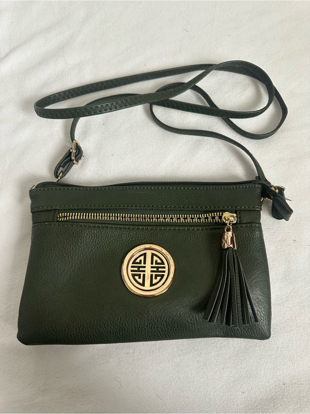 Source Unknown Dark Green Crossbody Bag with Gold Emblem and Tassel